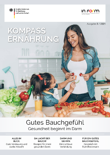 Cover der aktuellen Ausgabe mit Foto einer Frau mit einem Mädchen in einer Küche. Es liegt Gemüse auf dem Schneidebrett. Das Mädchen formt vor dem Bauch der Frau aus Gemüse ein lächelndes Gesicht.