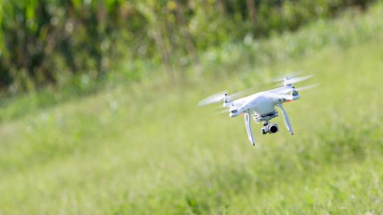A drone against a green background