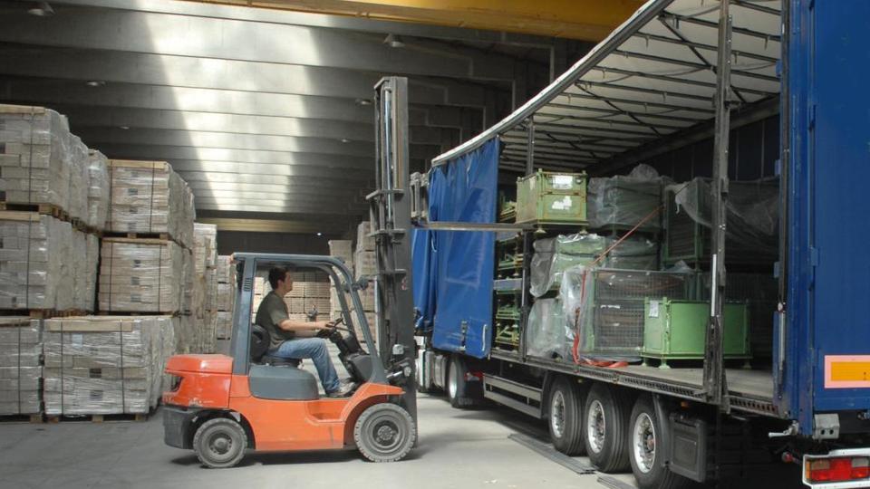 Forklift truck unloading a lorry